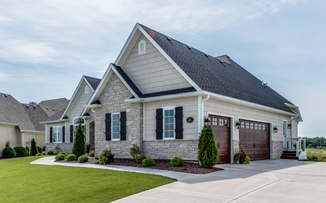 A well-maintained home exterior with manicured lawn, fresh paint, upgraded front door, and inviting outdoor space highlighting curb appeal before listing a home for sale.